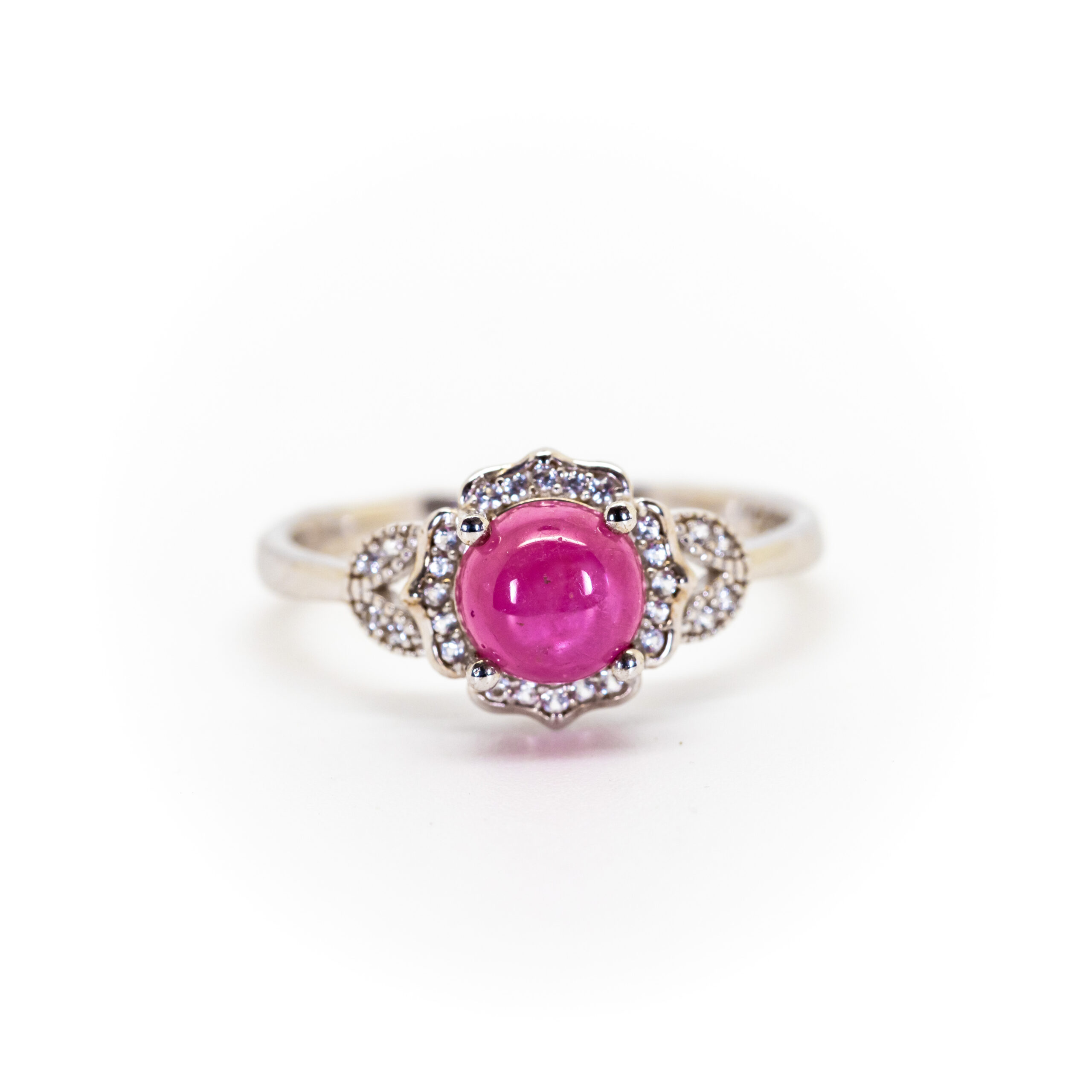 Vintage-Inspired Ruby Cabochon Ring with White Topaz Floral Halo