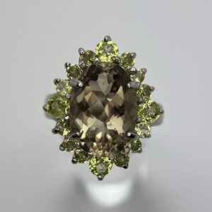 Faceted Citrine Oval with Clawed Peridot Halo Ring