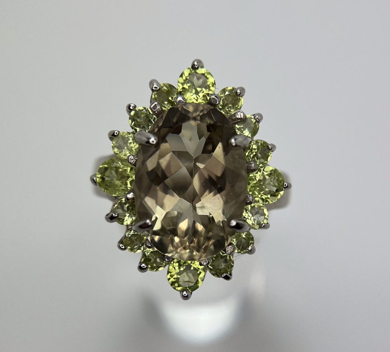 Faceted Citrine Oval with Clawed Peridot Halo Ring