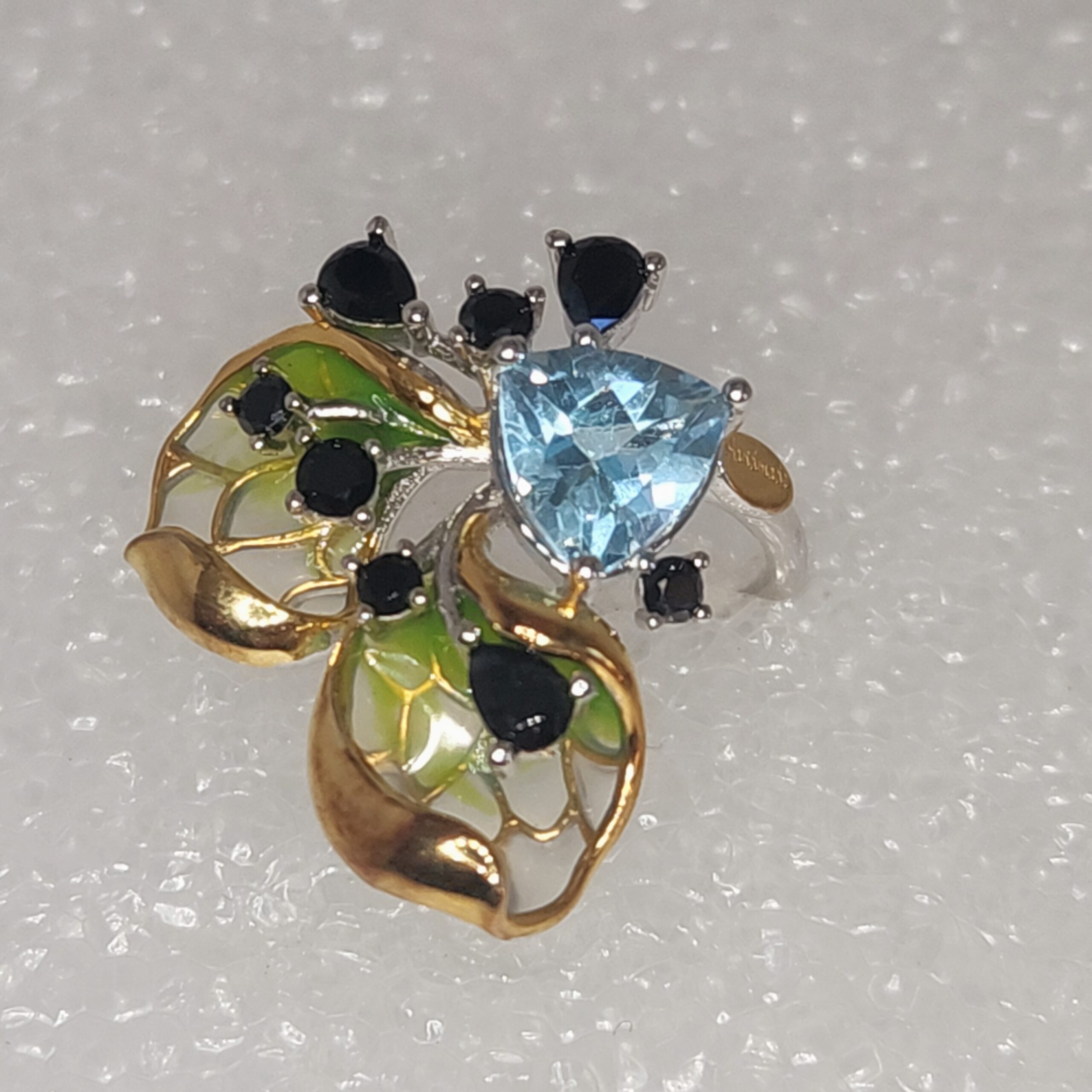 Blue Topaz Brilliant Ring with Black Spinel Accents and Vermeil Enamel Petals