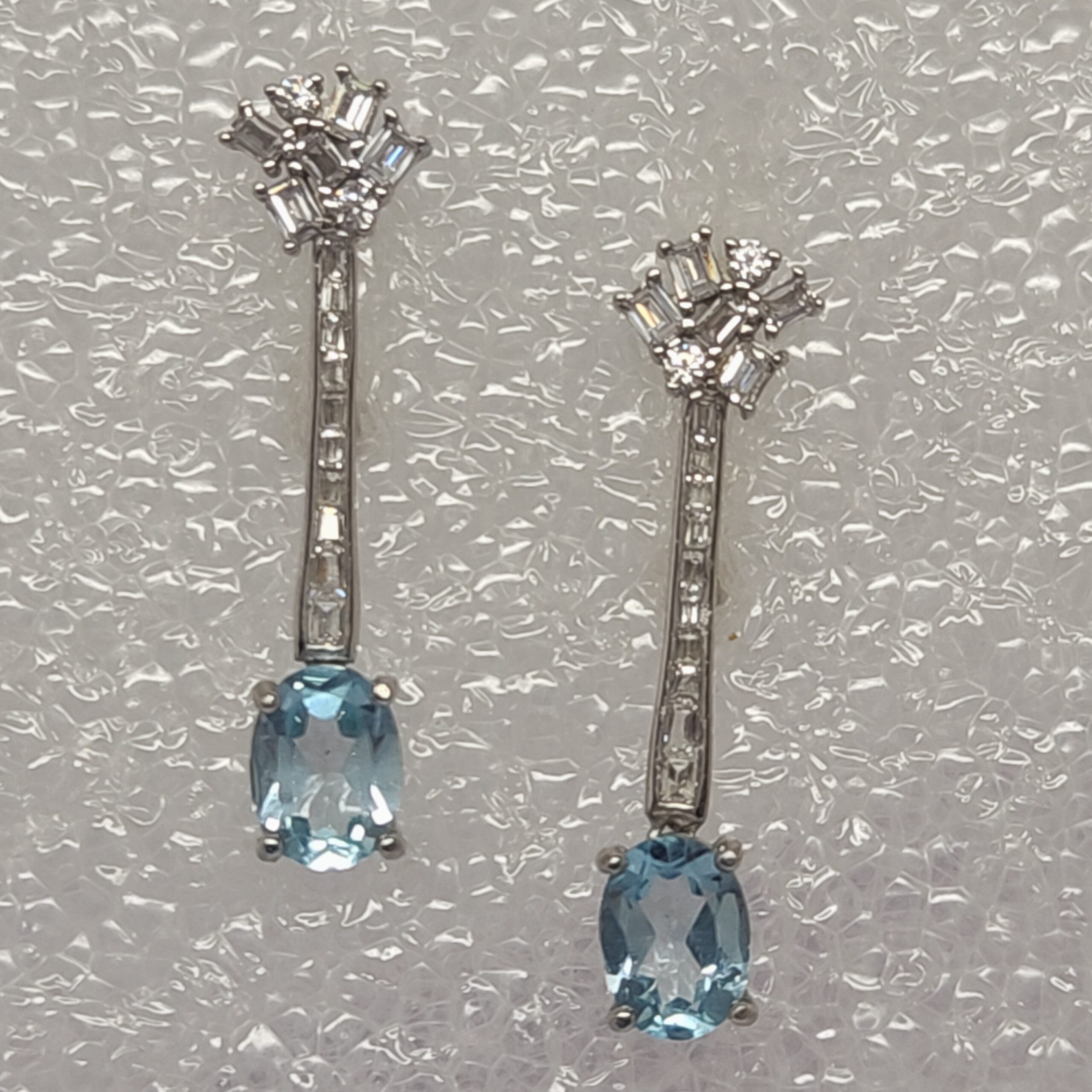 Oval Blue Topaz Drop Earrings with CZ Accent